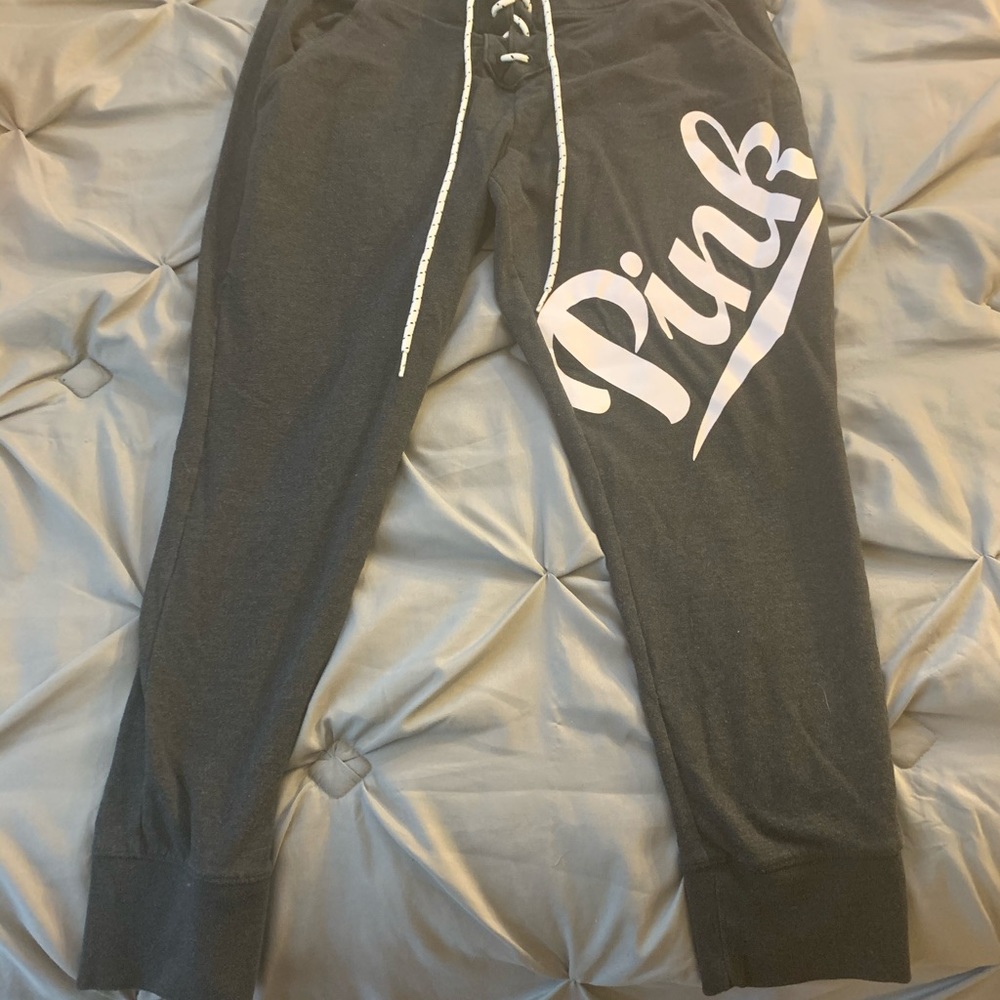 Pink sweat pants with drawstring and pockets